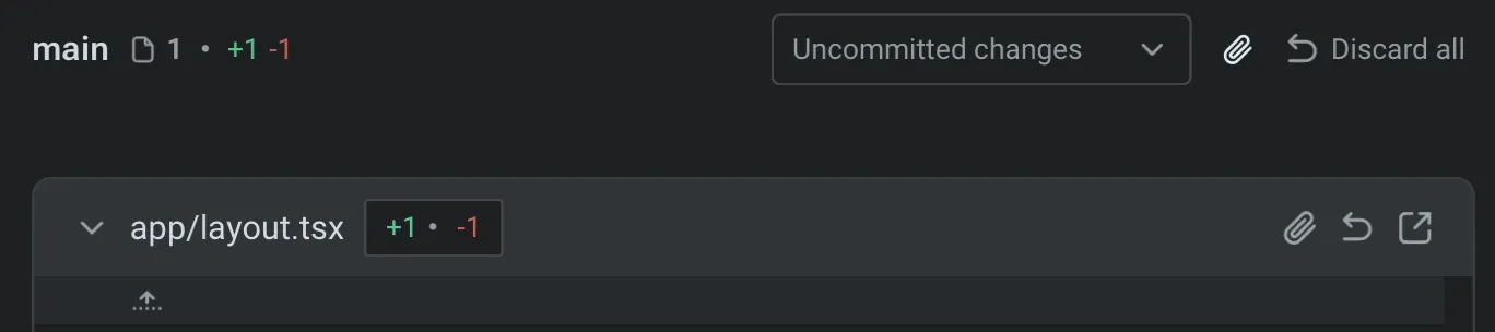 Code Review panel header showing file name, lines changed, and buttons for attach, revert, and open in editor